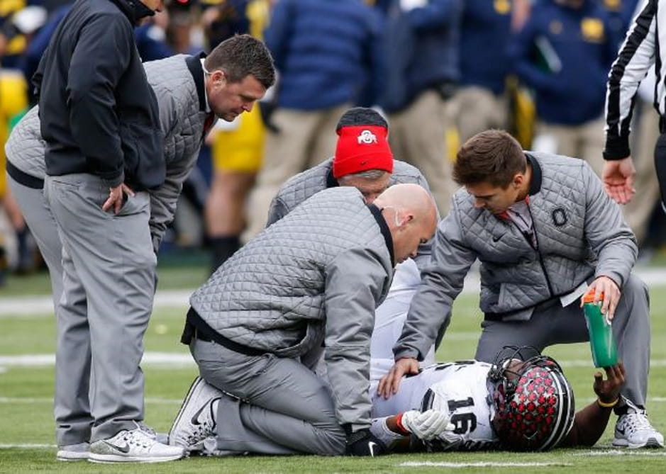 preforming test on an injured OSU football player 