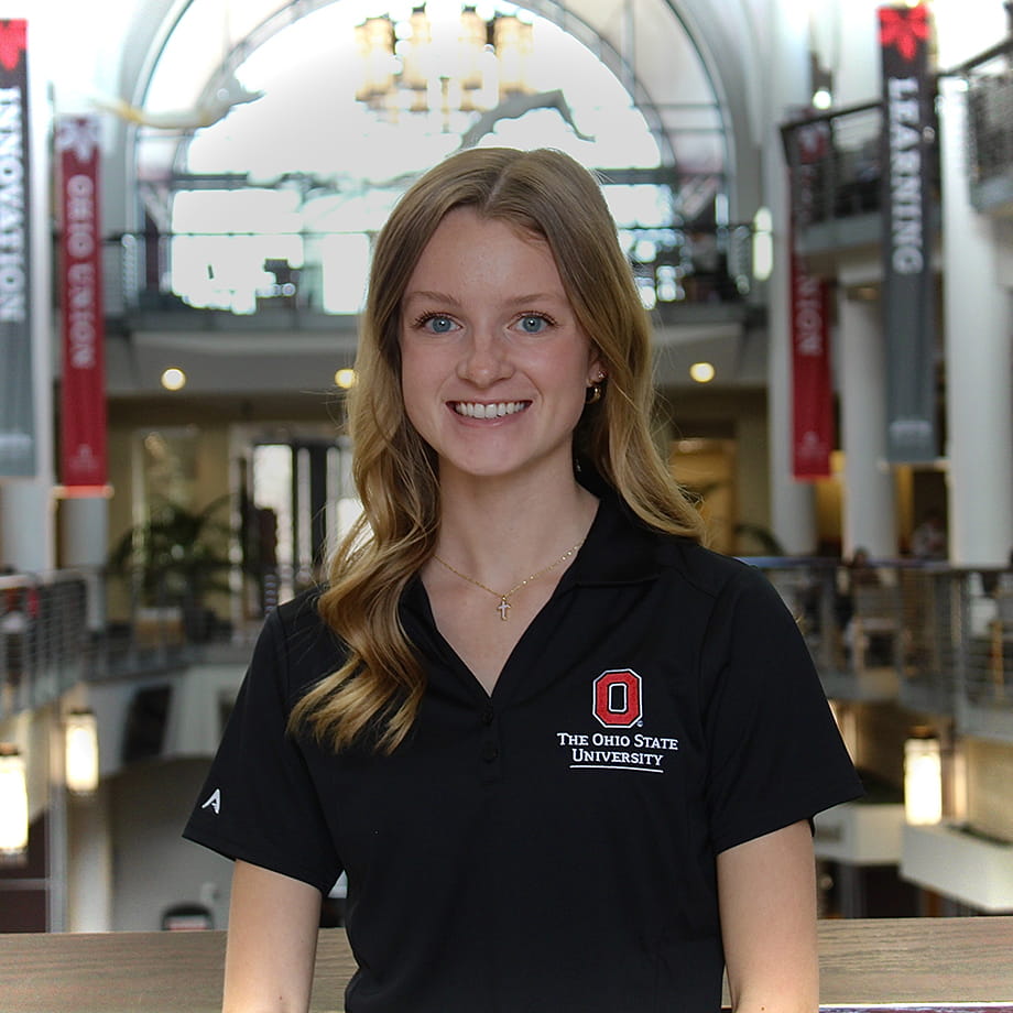 Halle Hamilton standing and smiling with the inside of the Ohio Union in the background