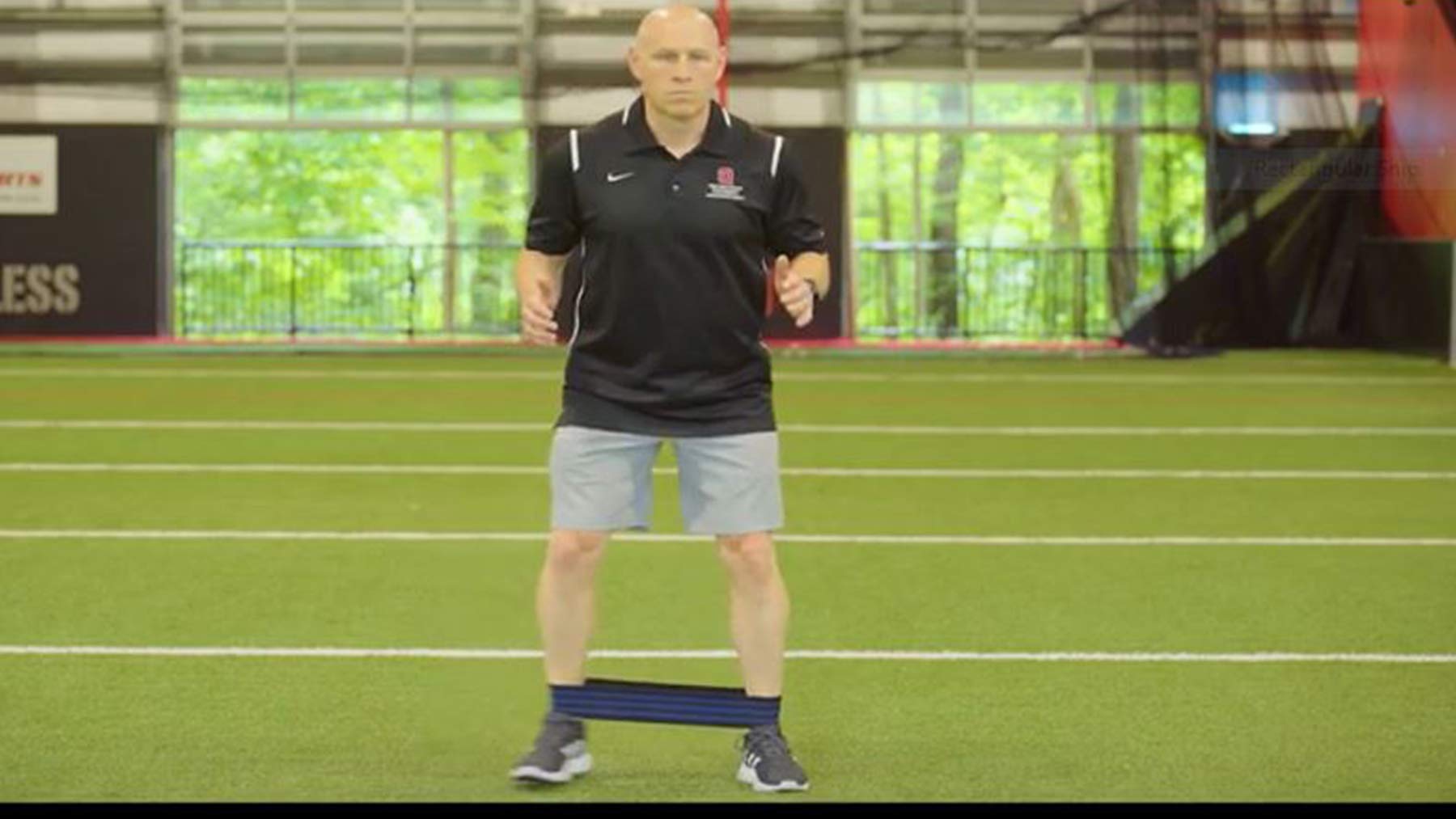 Chris Kolba demonstrates the resisted side-step exercise to strengthen hip muscles.
