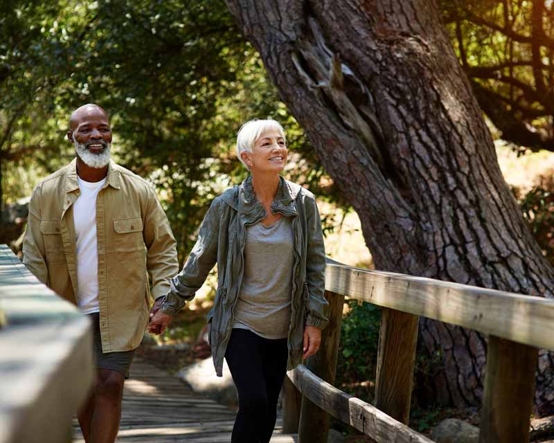 OlderCoupleJoyfullyWalking