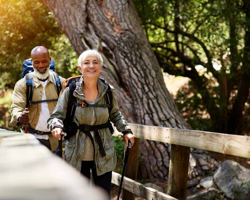 OlderCoupleJoyfullyHiking