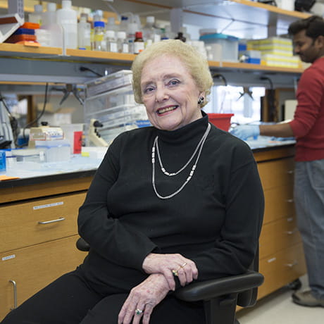 Catherine Hantek wearing black and sitting in wheelchair in lab
