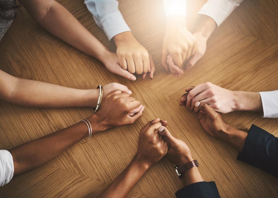 Hands holding in support